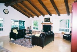 Living room with beamed cielings, bamboo floor
